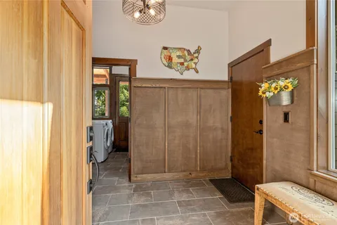 a kitchen with a sink and a stove next to a window