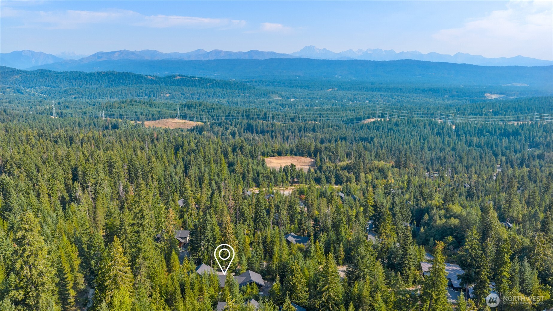 632 Trailside Drive Cle Elum, WA 98922 - Photo 32 of 39 a view of a lush green hillside and a houses
