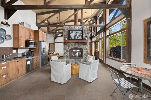 a swimming pool with outdoor seating and trees