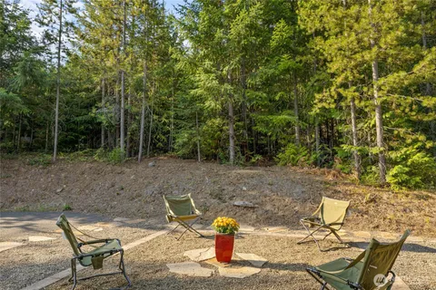 a view of a bench in a backyard