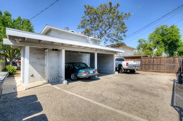 a view of parking area and car parked