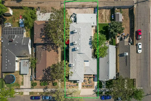 an aerial view of a house with a yard and fountain