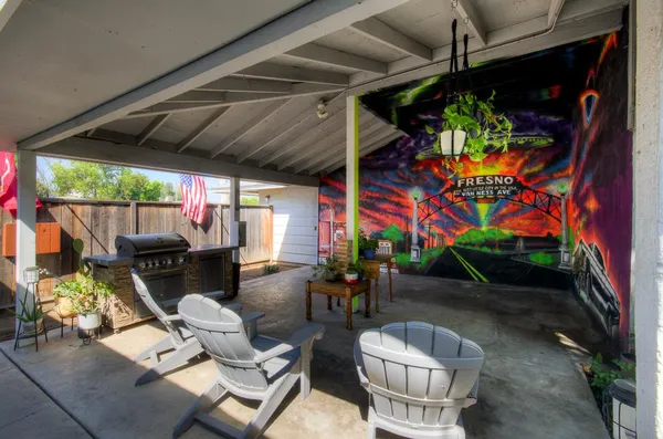 a patio with a table and chairs