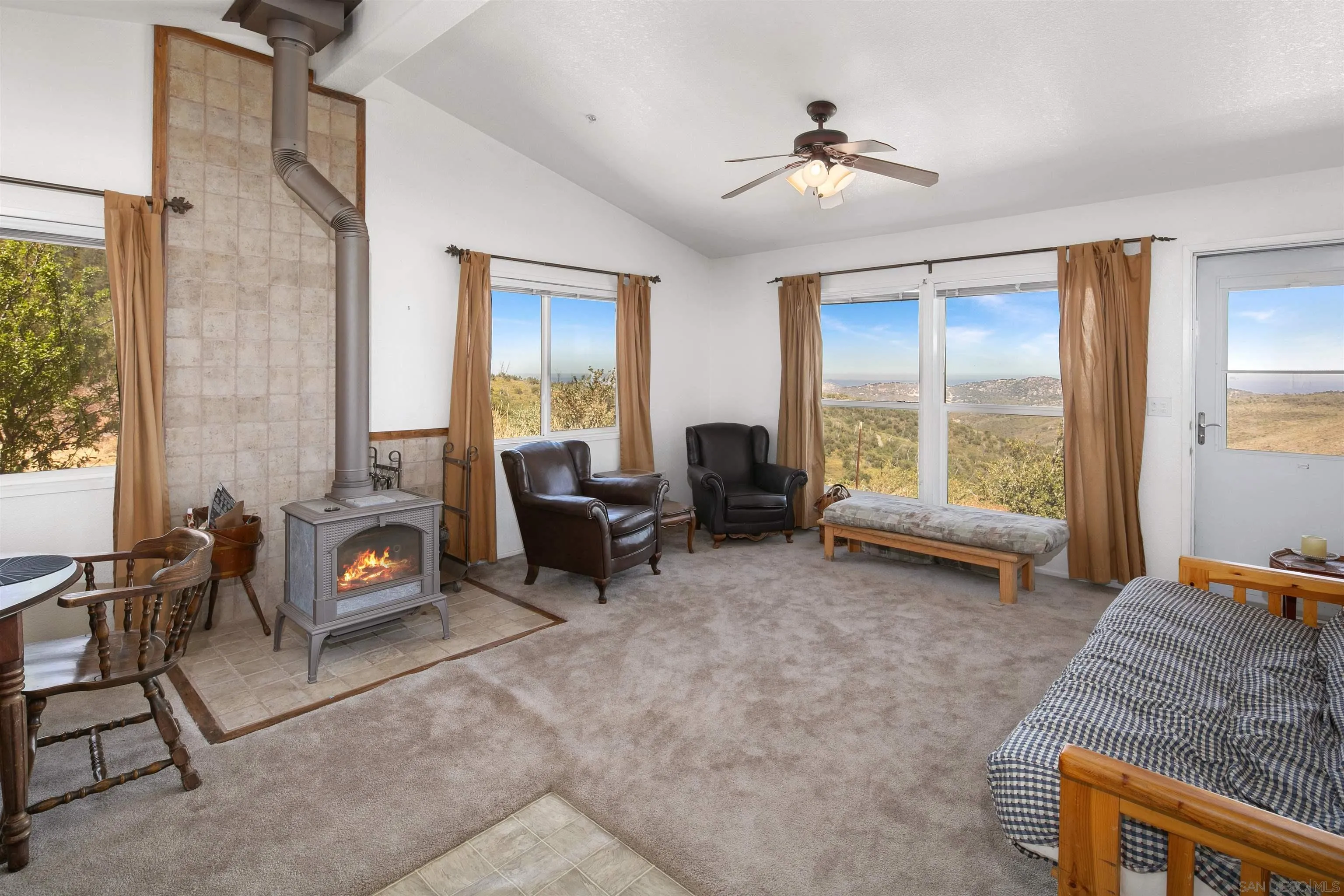 5017 Acorn Patch Road Julian, CA 92036 - Photo 3 of 12 a living room with furniture and a window