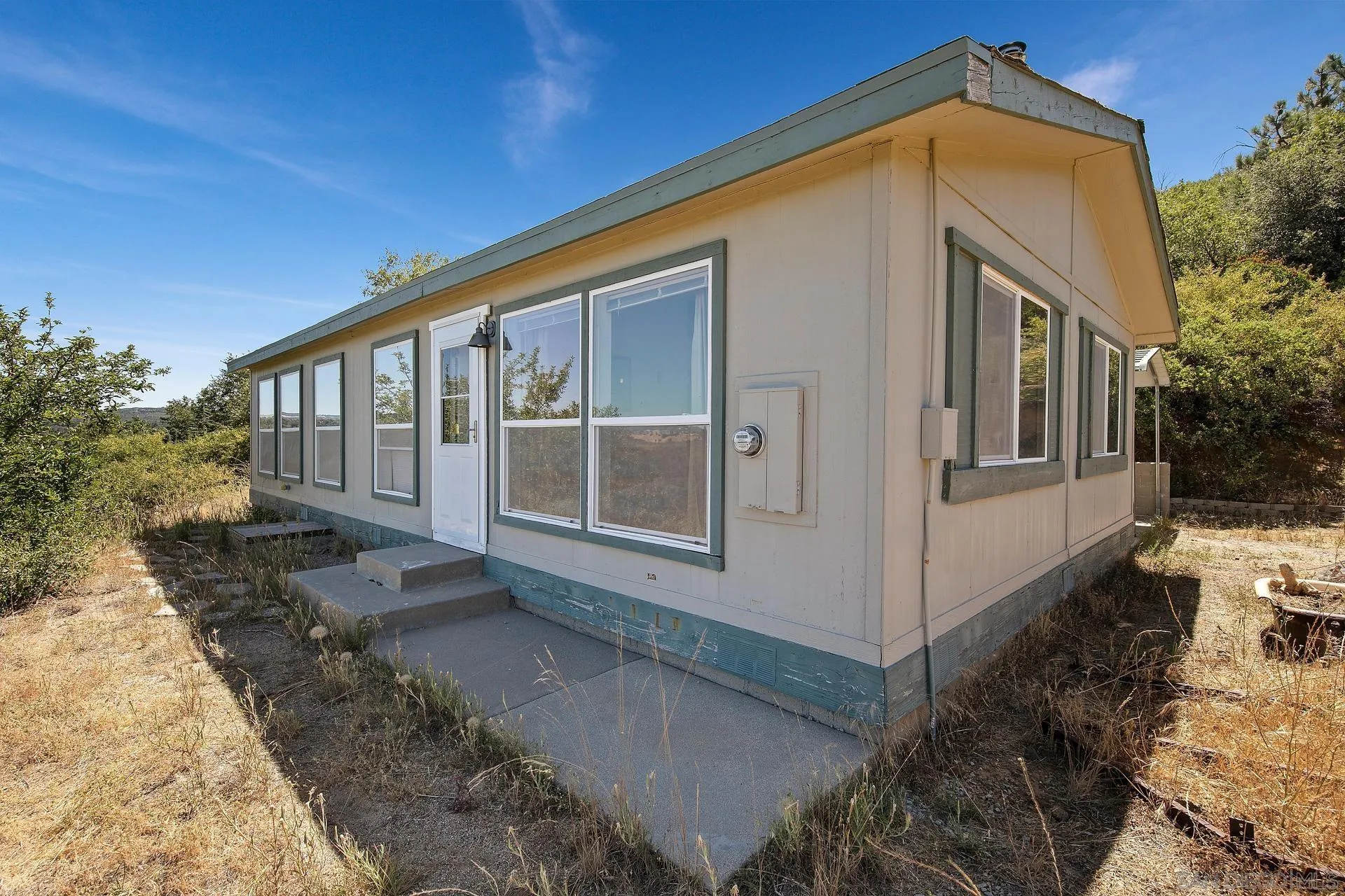 5017 Acorn Patch Road Julian, CA 92036 - Photo 10 of 12 a front view of a house with a yard