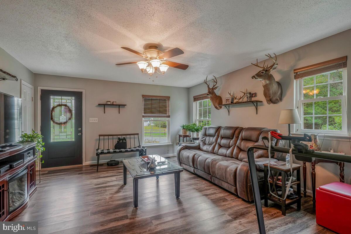 6115 Port Tobacco Road La Plata, MD 20646 - Photo 9 of 27 a living room with furniture a wooden floor and a window