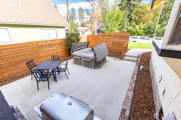 swimming pool view with a seating space