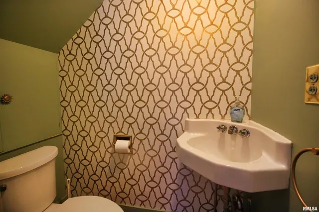 a bathroom with a sink and a toilet