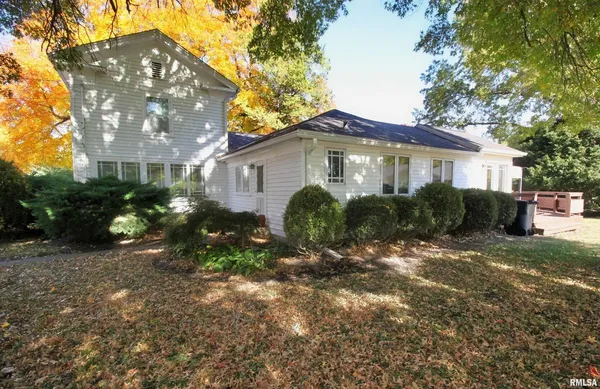 a view of a house with a yard and plants