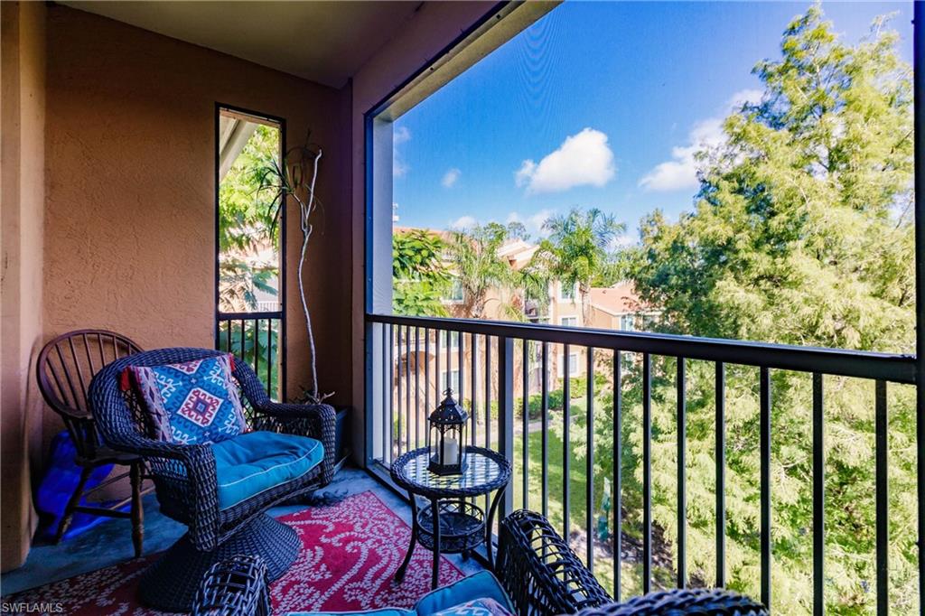 1230 Reserve Way, Unit 302 Naples, FL 34105 - Photo 17 of 28 a living room with furniture and a potted plant