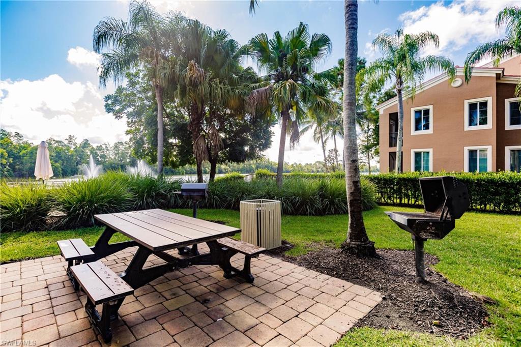 1230 Reserve Way, Unit 302 Naples, FL 34105 - Photo 23 of 28 a view of a backyard with sitting area furniture and garden