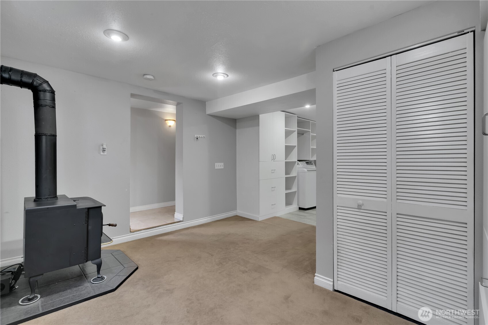 1547 Southwest Myrtle Street Seattle, WA 98106 - Photo 18 of 40 a view of a hallway with workspace and a window
