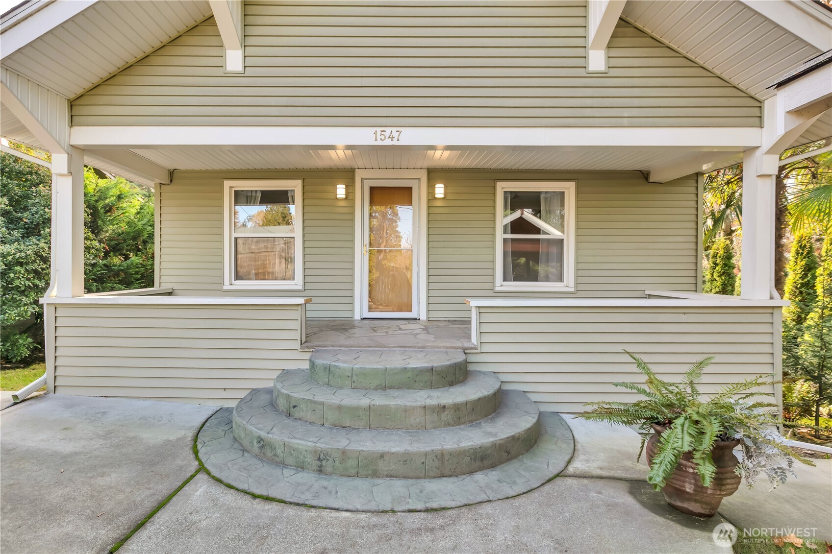 1547 Southwest Myrtle Street Seattle, WA 98106 - Photo 2 of 40 a view of a house with a chairs in patio