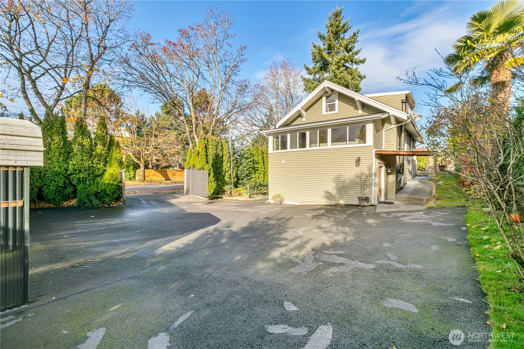 1547 Southwest Myrtle Street Seattle, WA 98106 - Photo 36 of 40 a front view of a house with a yard and garage