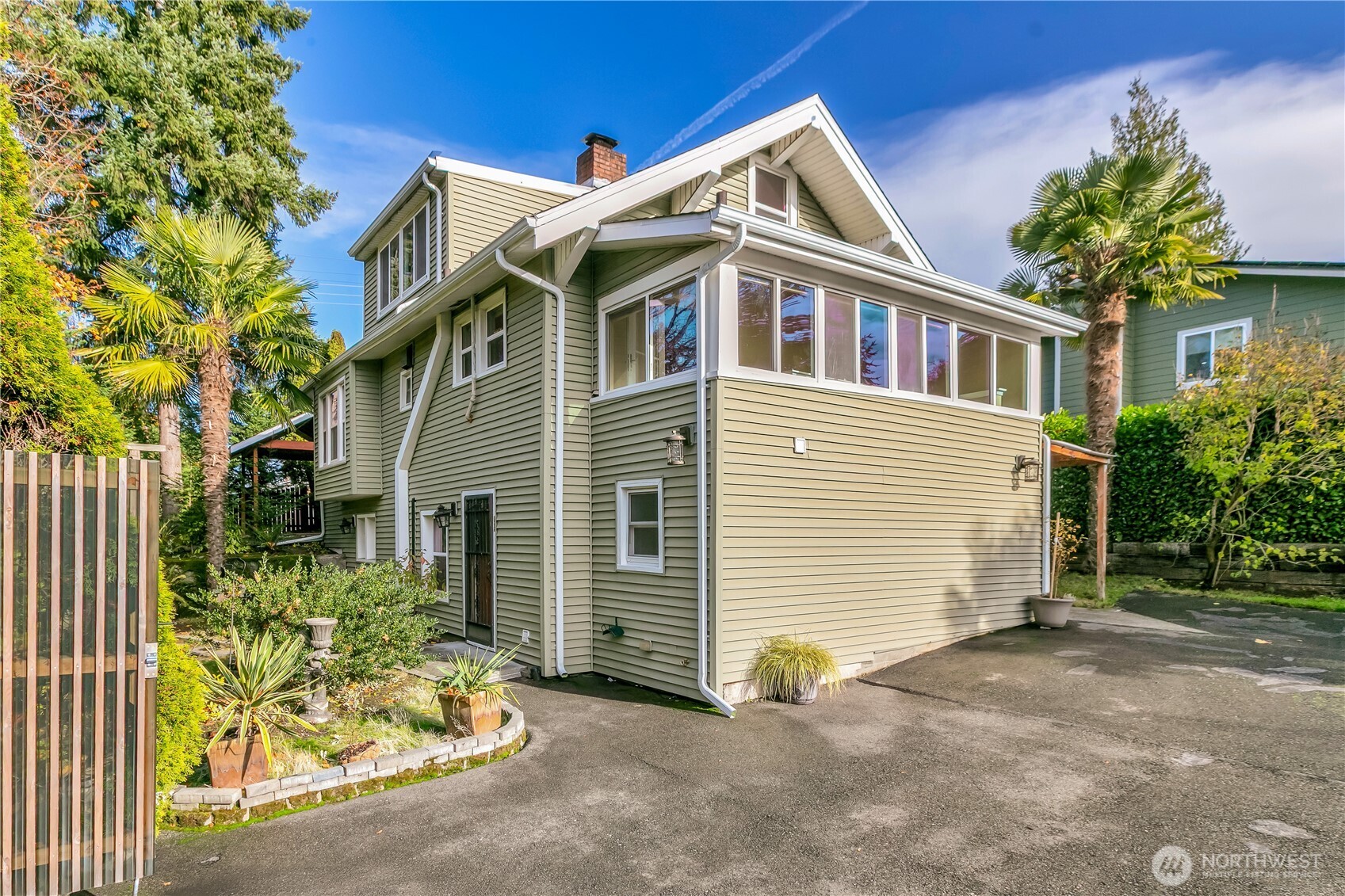 1547 Southwest Myrtle Street Seattle, WA 98106 - Photo 4 of 40 a front view of a house with a yard