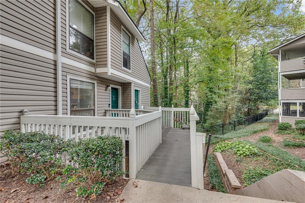 1214 Wynnes Ridge Circle Southeast Marietta, GA 30067 - Photo 21 of 24 a front view of a house with a garden