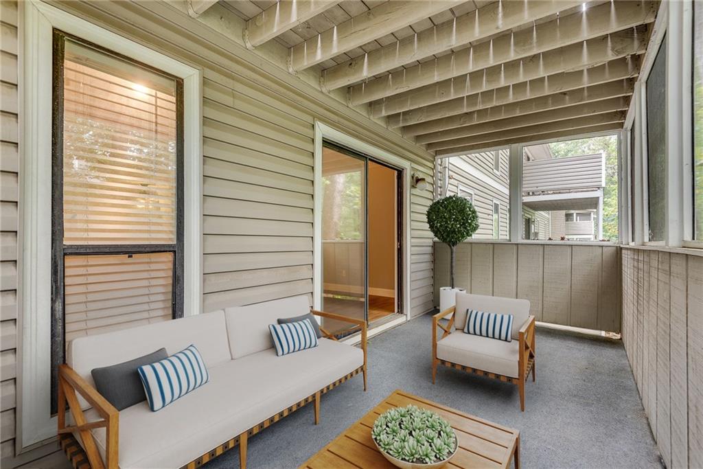 1214 Wynnes Ridge Circle Southeast Marietta, GA 30067 - Photo 4 of 24 a balcony with furniture and a large window