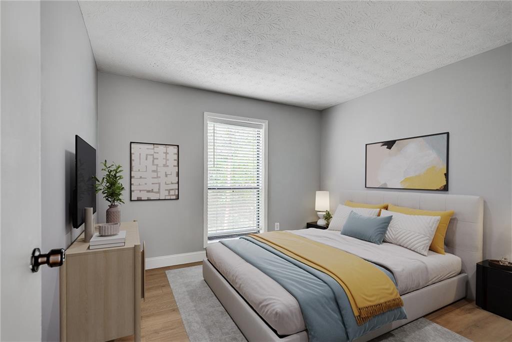 1214 Wynnes Ridge Circle Southeast Marietta, GA 30067 - Photo 6 of 24 a bedroom with a bed and a window