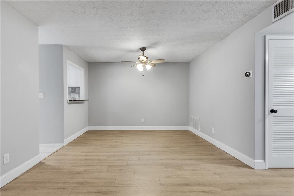 1214 Wynnes Ridge Circle Southeast Marietta, GA 30067 - Photo 10 of 24 wooden floor in an empty room with a window