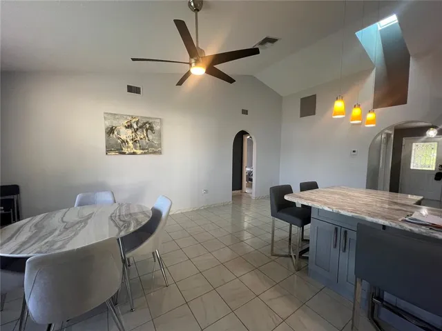 a view of a kitchen with a sink and a dishwasher
