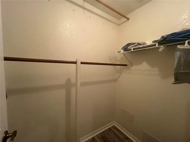 a bathroom with a double vanity sink and mirror