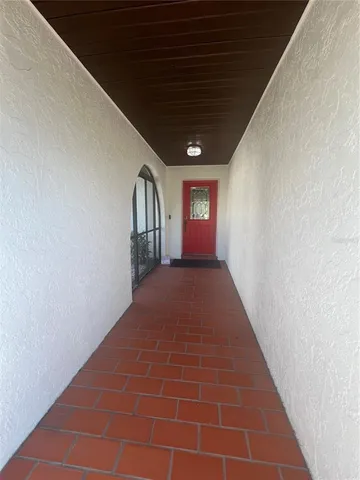 a view of hallway with a window