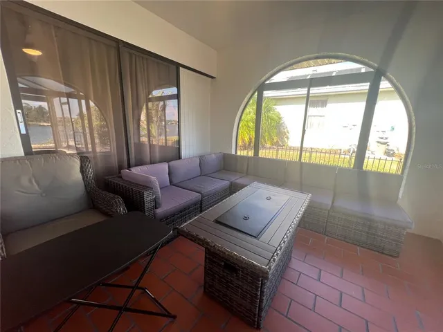 a hallway with wooden floor and furniture