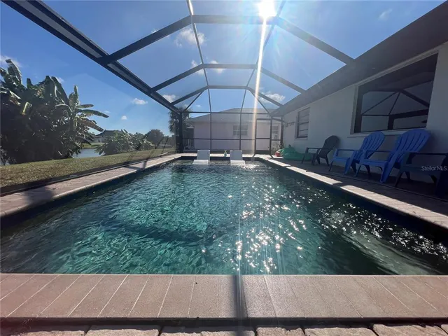 a view of a swimming pool with a patio