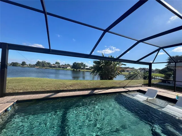 a view of swimming pool with lounge chair