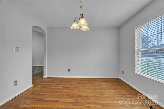 a kitchen with a stove sink microwave and refrigerator