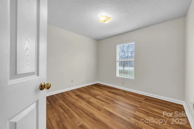 a view of a livingroom with wooden floor