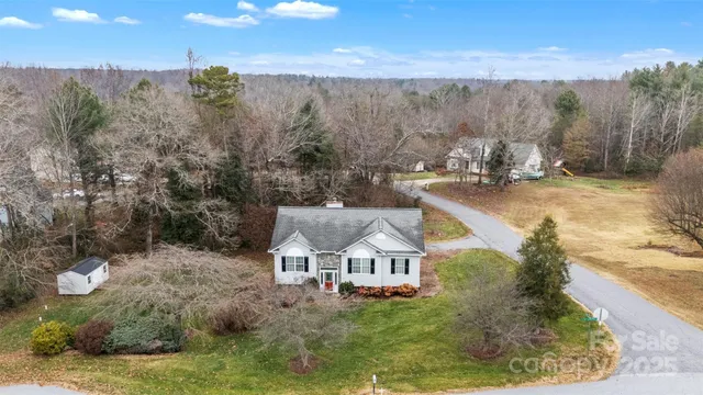 a view of a back yard from a balcony