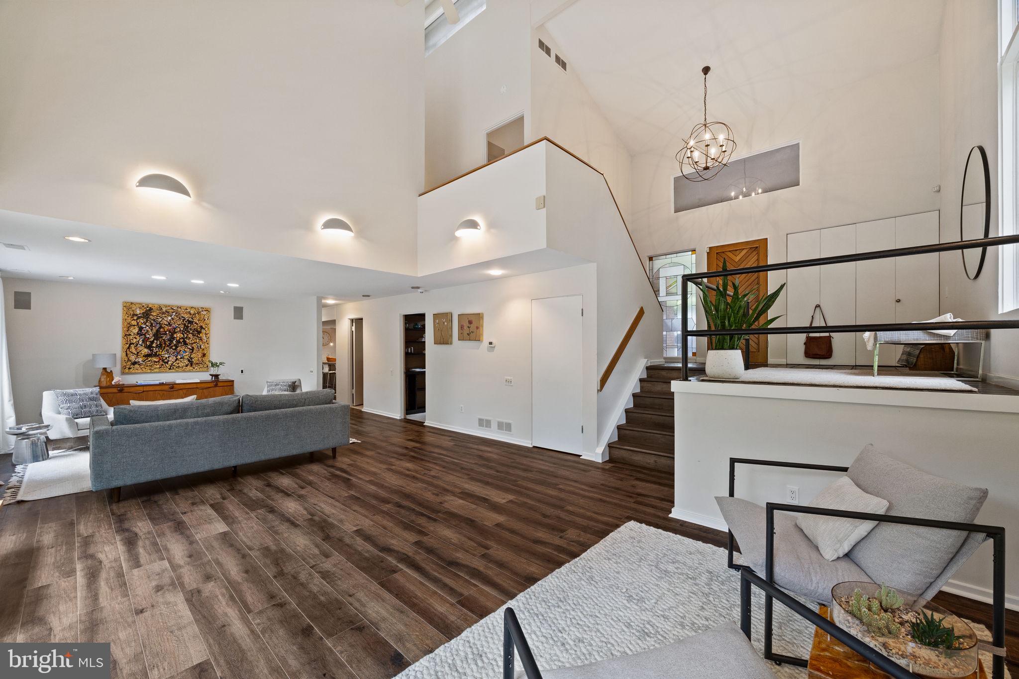 175 Old Gulph Road Wynnewood, PA 19096 - Photo 17 of 87 a living room with furniture and a chandelier