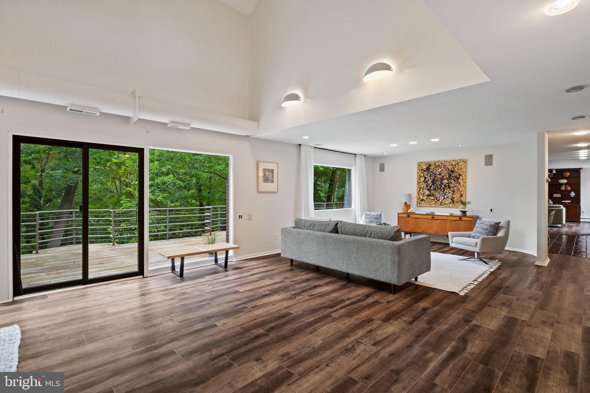 175 Old Gulph Road Wynnewood, PA 19096 - Photo 19 of 87 a living room with furniture and large windows