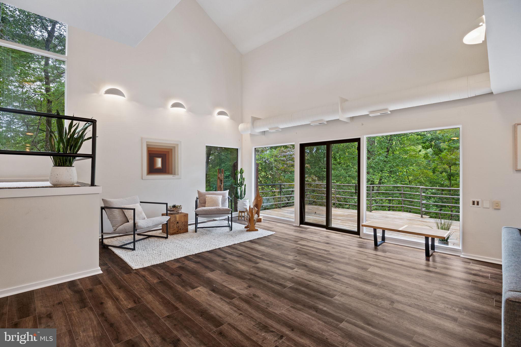 175 Old Gulph Road Wynnewood, PA 19096 - Photo 20 of 87 a living room with furniture and large windows