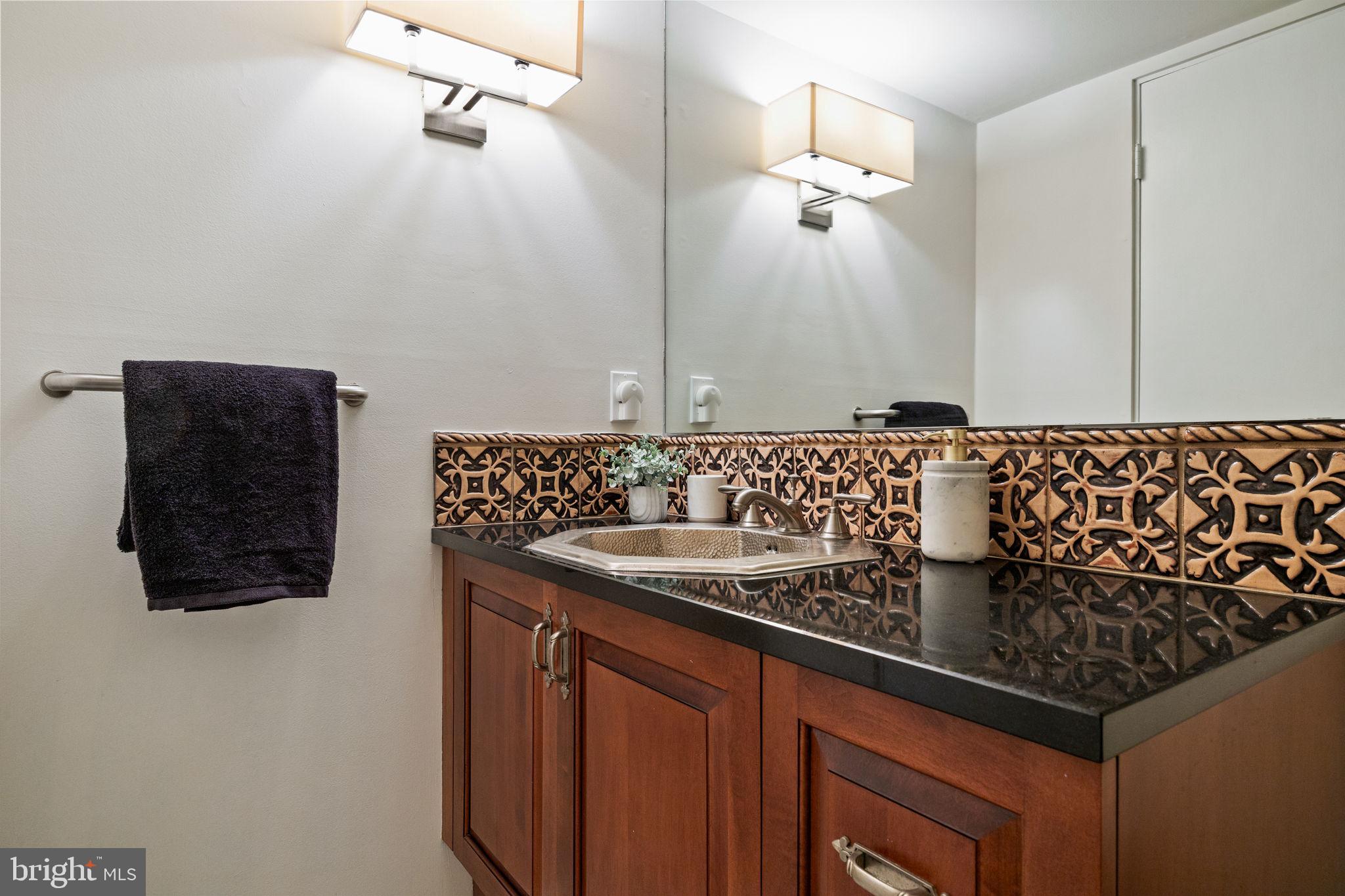 175 Old Gulph Road Wynnewood, PA 19096 - Photo 28 of 87 a bathroom with a sink and a mirror