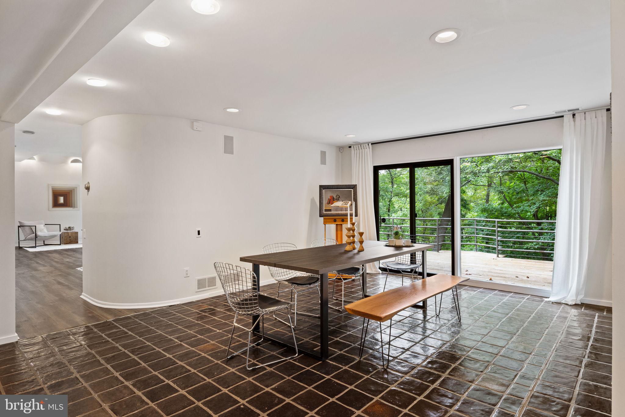 175 Old Gulph Road Wynnewood, PA 19096 - Photo 29 of 87 a living room with a large window a table and chairs