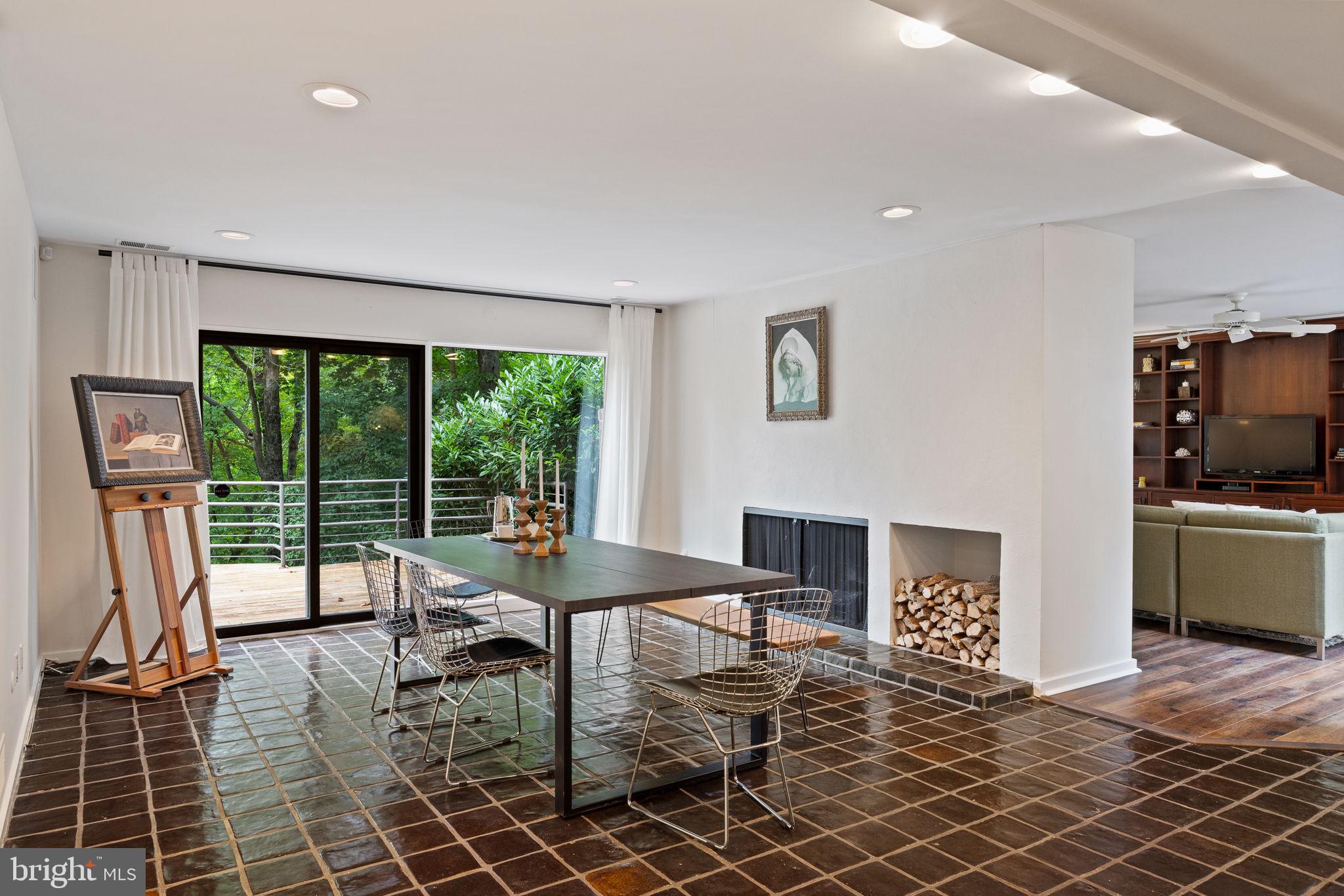175 Old Gulph Road Wynnewood, PA 19096 - Photo 30 of 87 a living room with furniture a flat screen tv and a floor to ceiling window