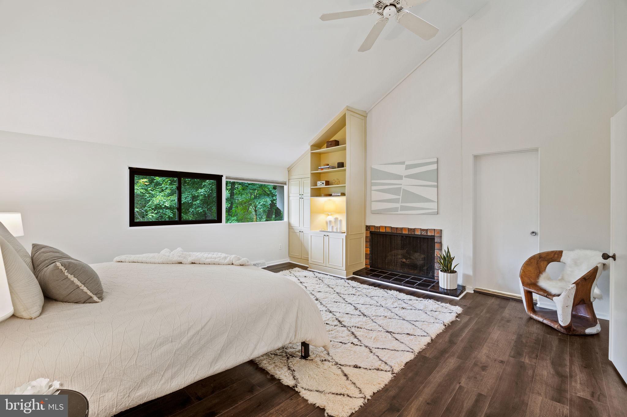 175 Old Gulph Road Wynnewood, PA 19096 - Photo 54 of 87 a bedroom with a bed and a fireplace