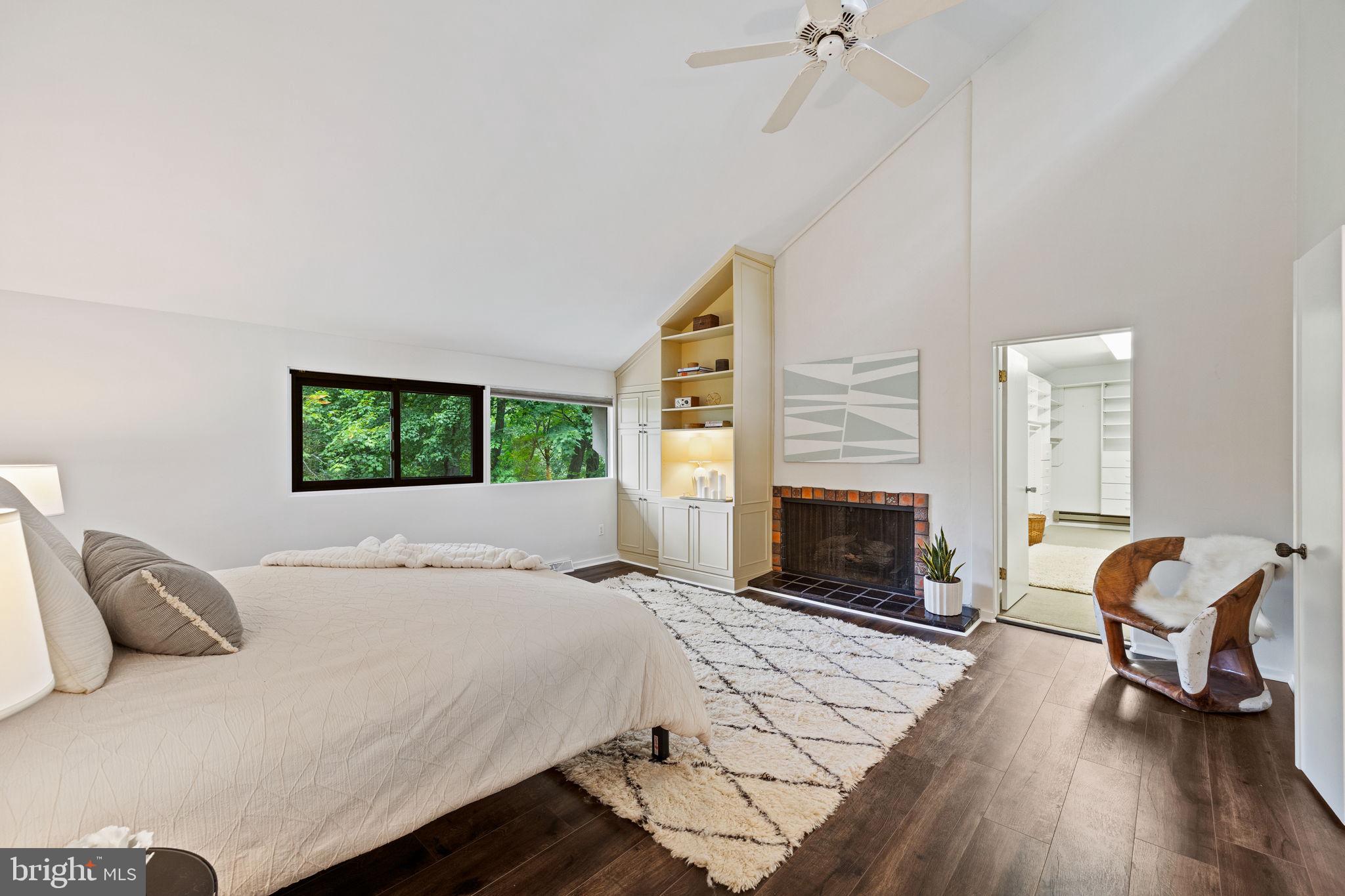 175 Old Gulph Road Wynnewood, PA 19096 - Photo 55 of 87 a bedroom with a bed and a fireplace