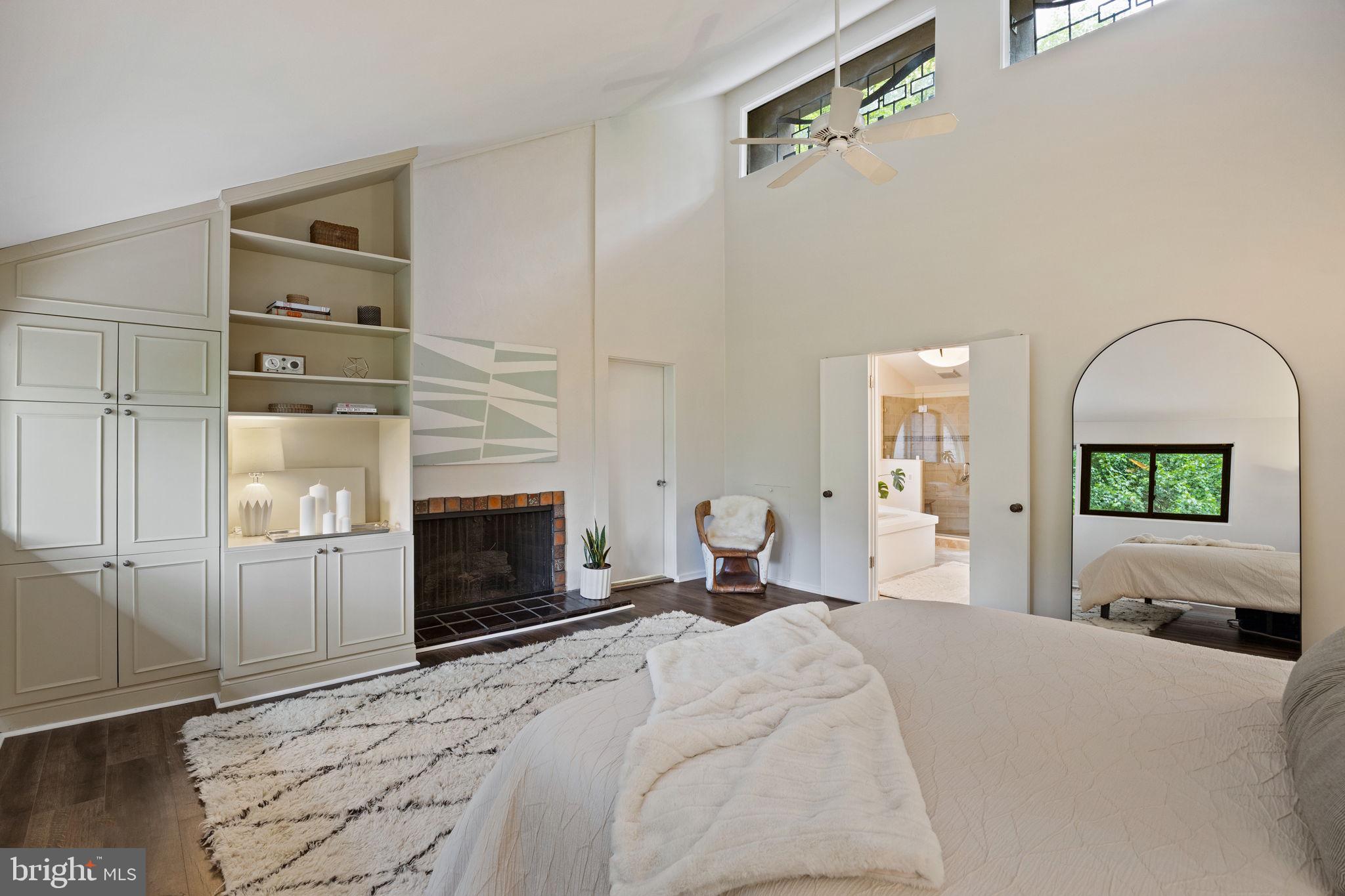 175 Old Gulph Road Wynnewood, PA 19096 - Photo 59 of 87 a bedroom with a bed and a fireplace