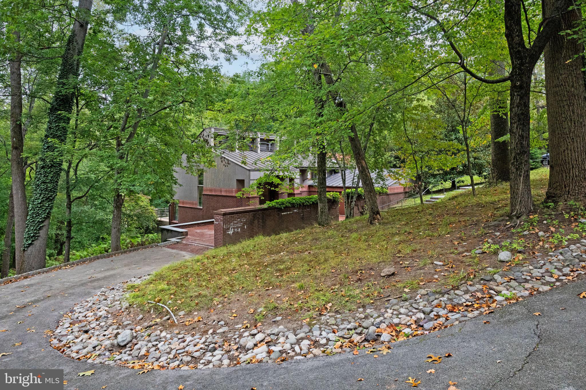 175 Old Gulph Road Wynnewood, PA 19096 - Photo 7 of 87 a view of backyard with a table and chairs