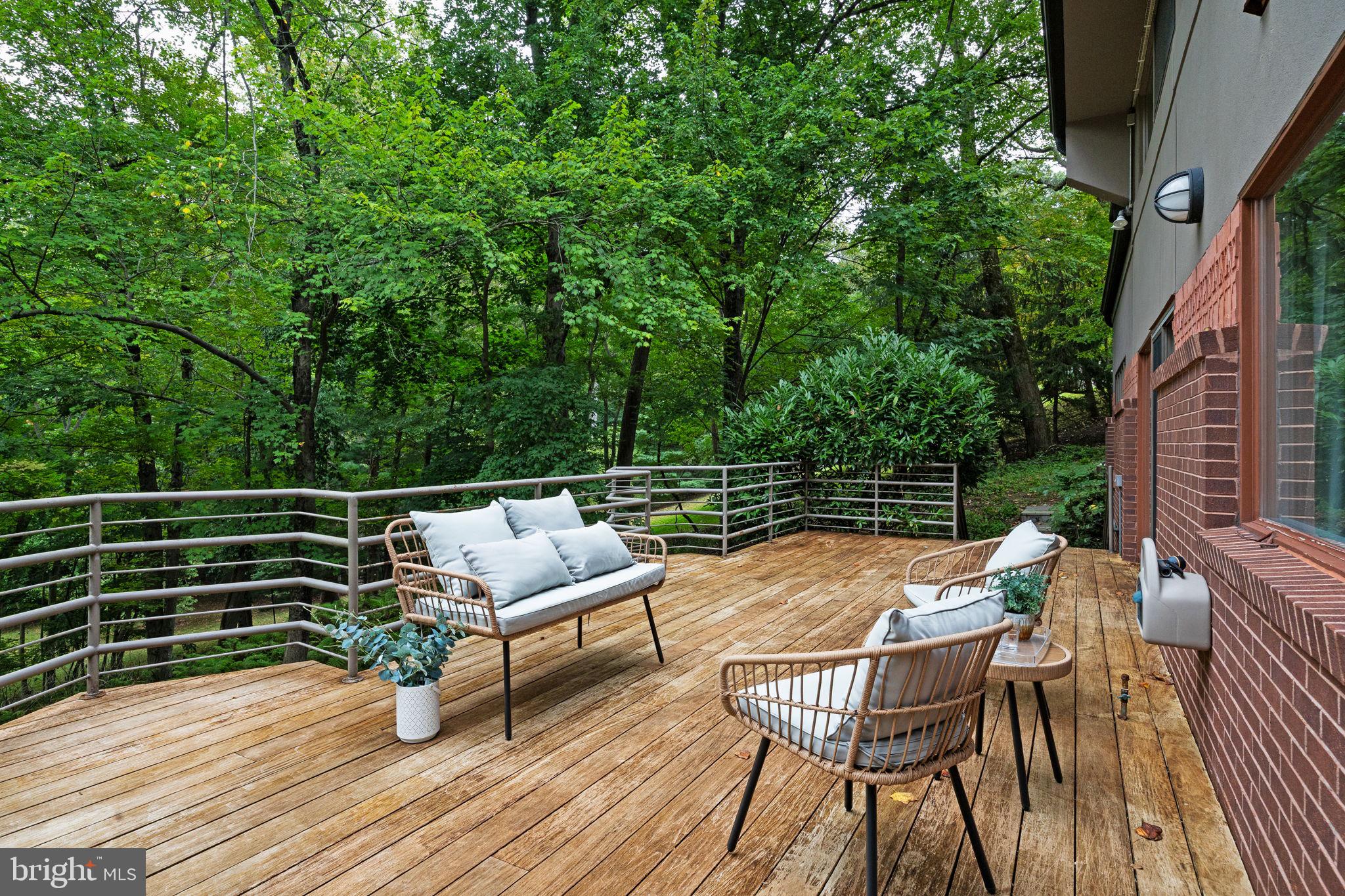 175 Old Gulph Road Wynnewood, PA 19096 - Photo 74 of 87 a view of a chairs and table on the wooden deck