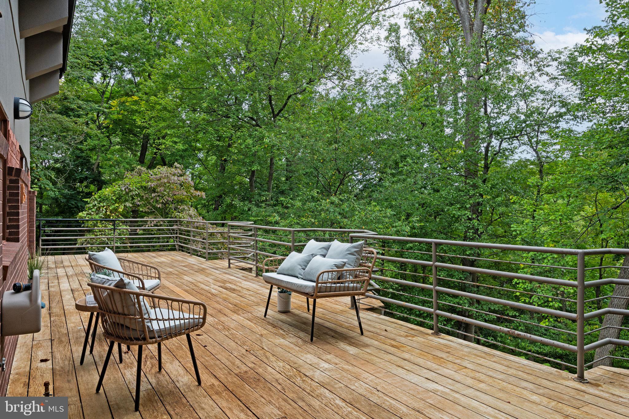 175 Old Gulph Road Wynnewood, PA 19096 - Photo 77 of 87 a backyard of a house with wooden floor and outdoor seating