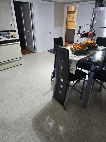 a view of dining room with furniture and window