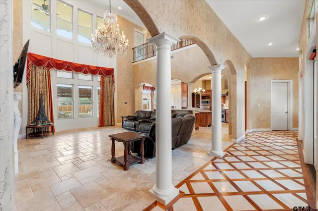 a outdoor space with lots of furniture and a chandelier