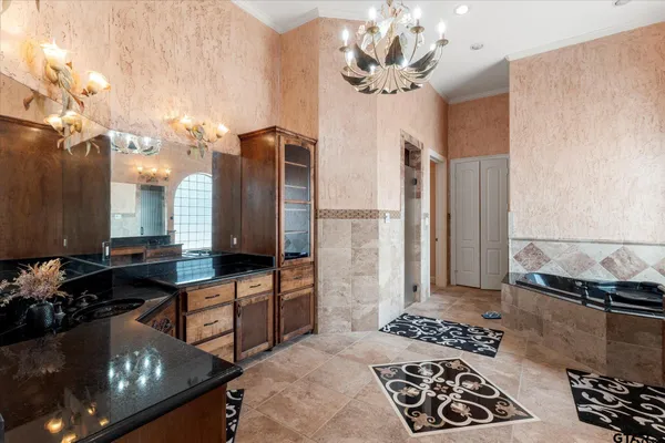 a bathroom with a glass shower door