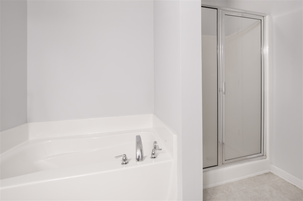 8215 Belneath Court Raleigh, NC 27613 - Photo 17 of 20 Tub and separate shower