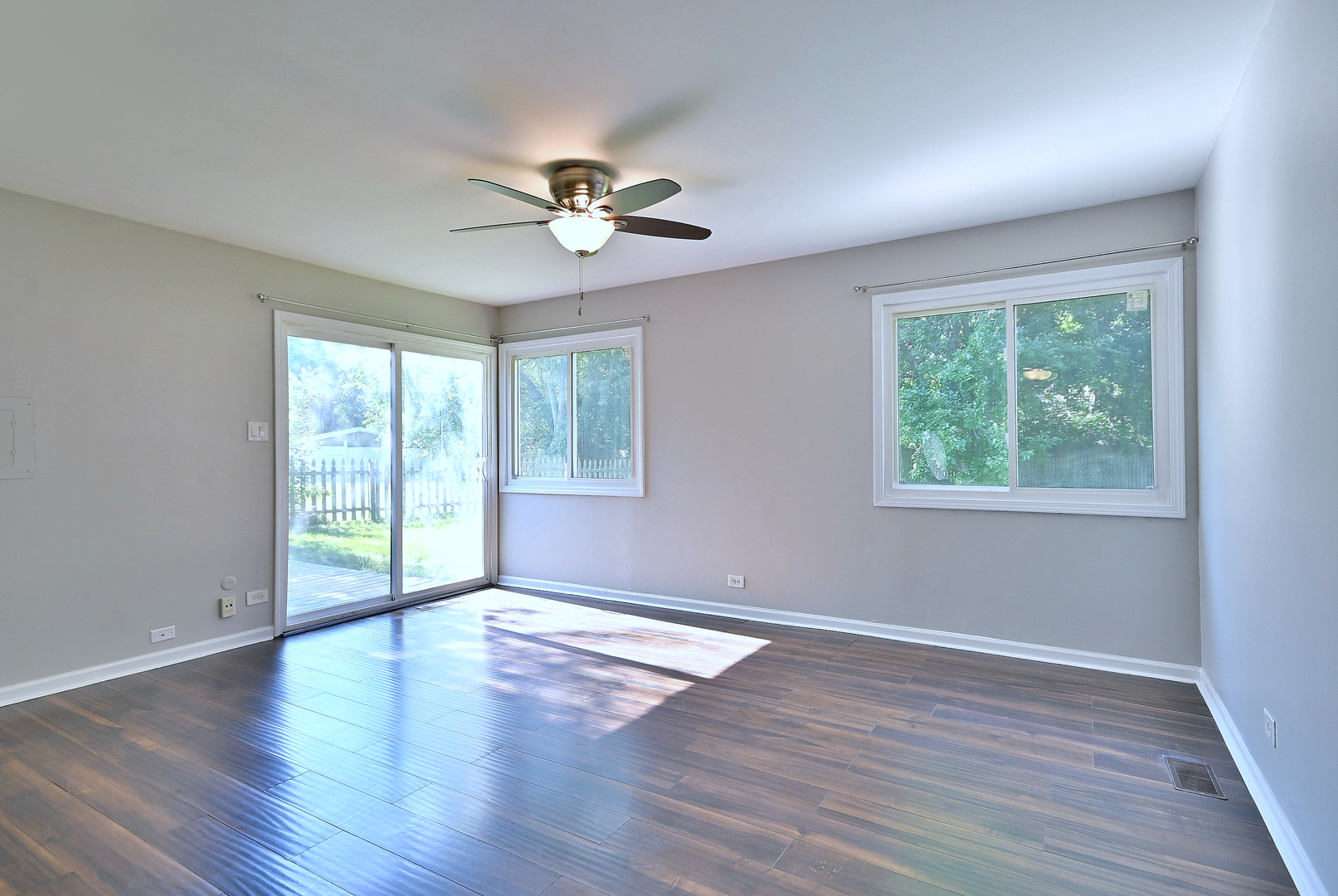 5629 Crestwood Road Matteson, IL 60443 - Photo 7 of 20 a view of an empty room with wooden floor and a window