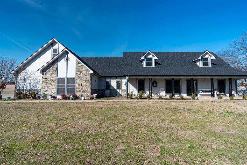 733 Ridgeview Drive Sherman, TX 75090 - Photo 2 of 40 a front view of a house with swimming pool and porch
